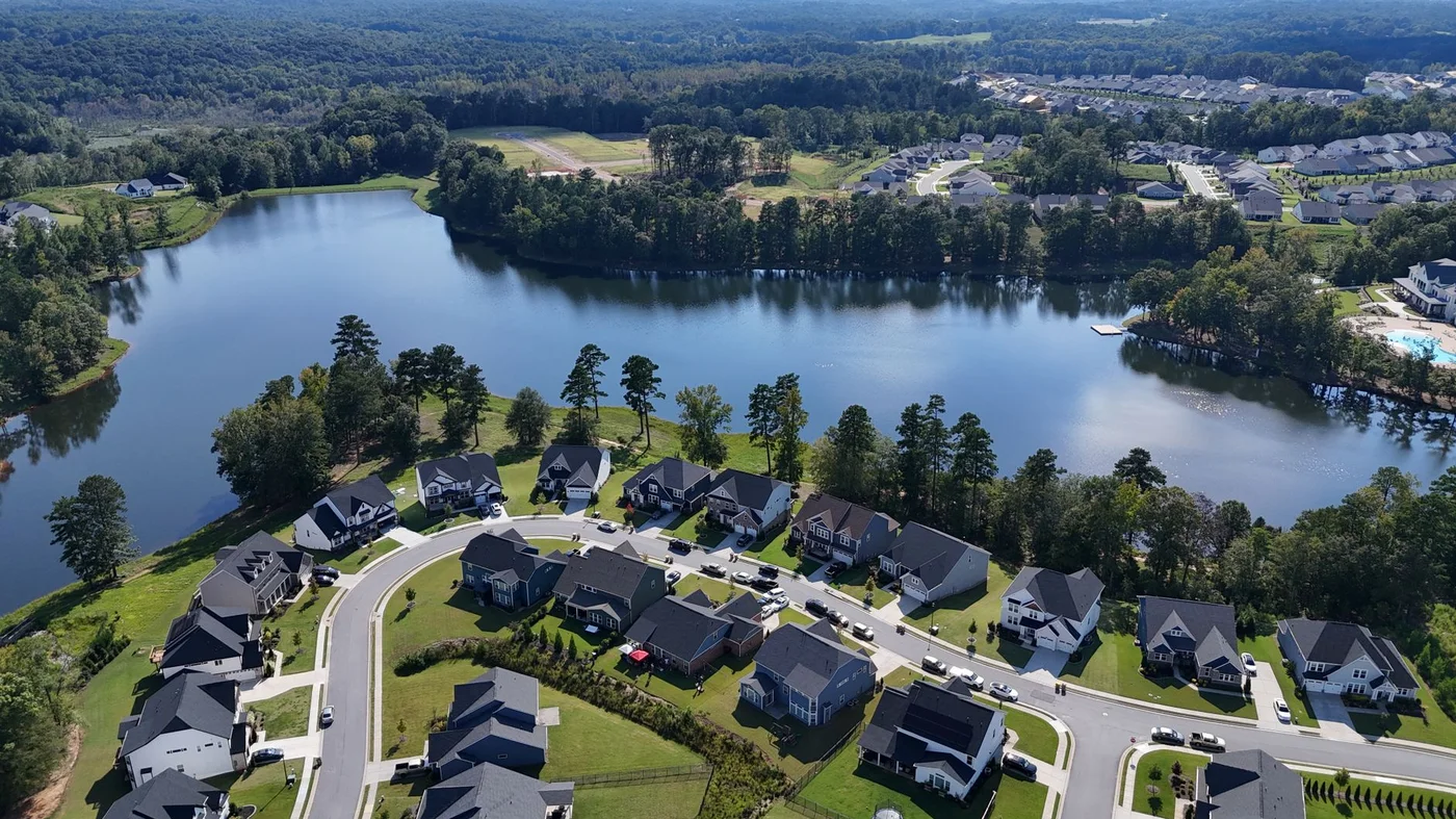 Aerial view of a suburban neighborhood beside a lake in Braselton, Georgia