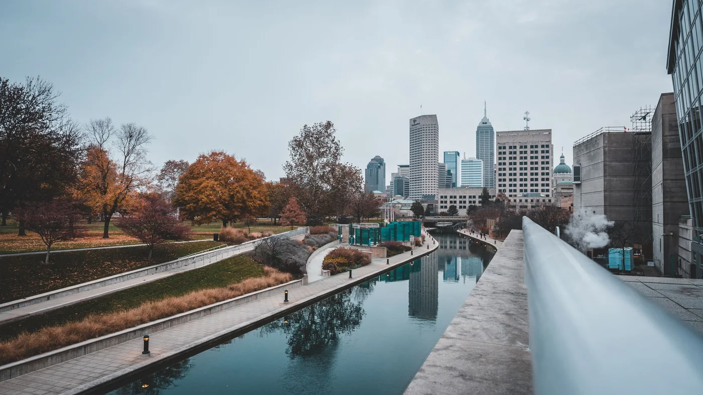 The Indianapolis canal with the downtown skyline and autumn colour reflected in the water