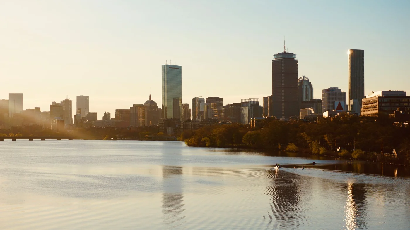 Boston skyline at sunset seen across the Charles River