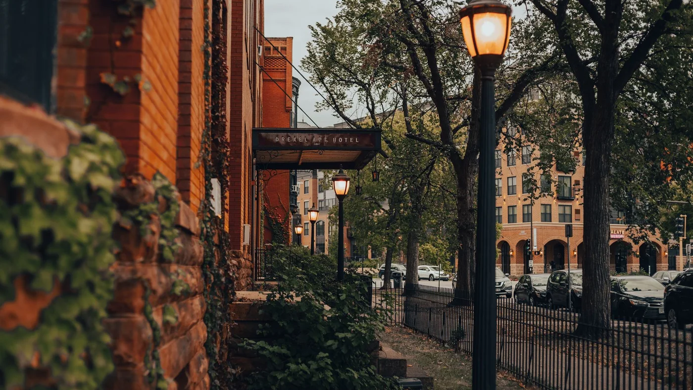 Historic brick buildings and street lamps on a Minneapolis street at dusk
