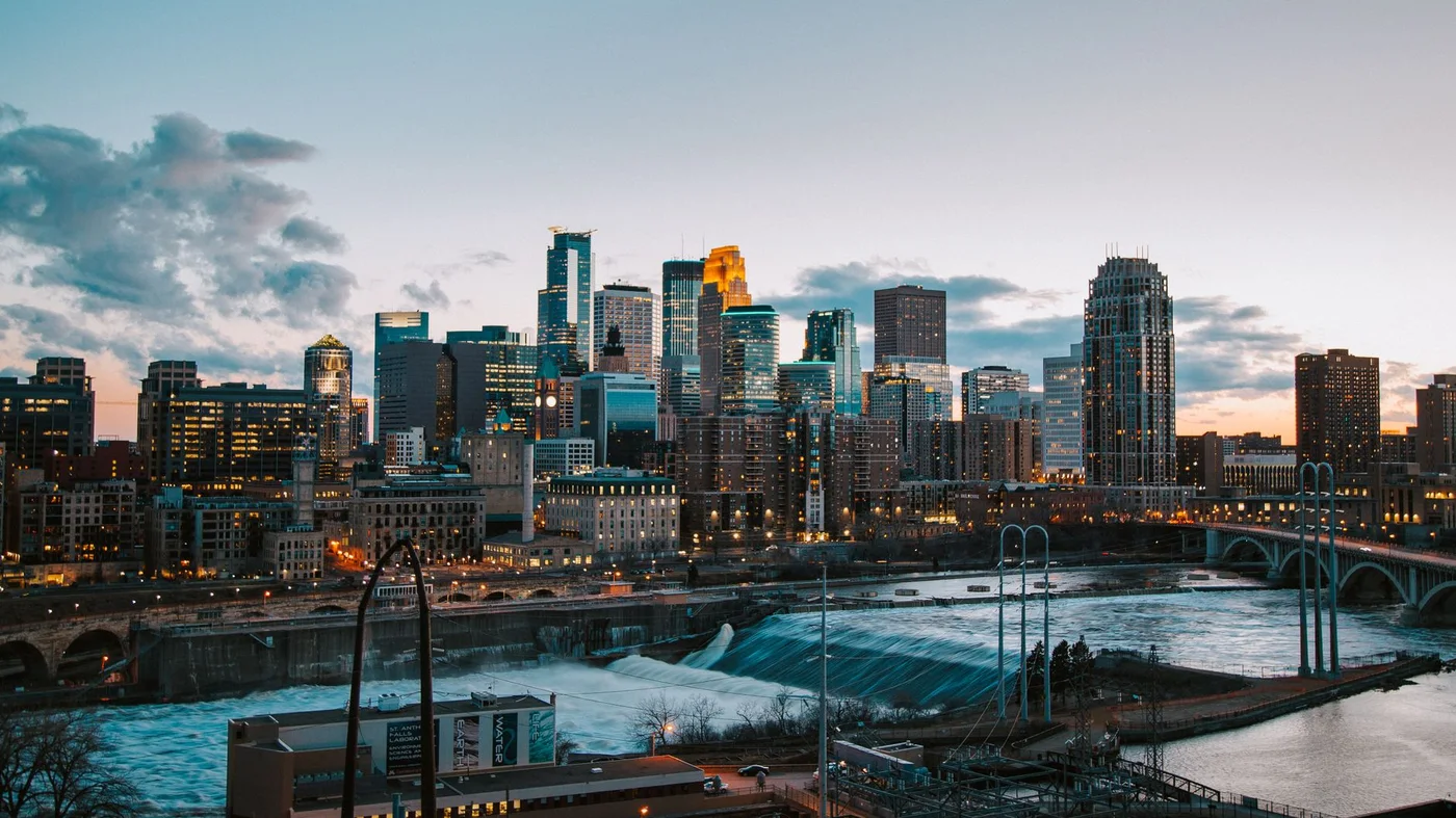 The Minneapolis skyline at sunset across the Mississippi River