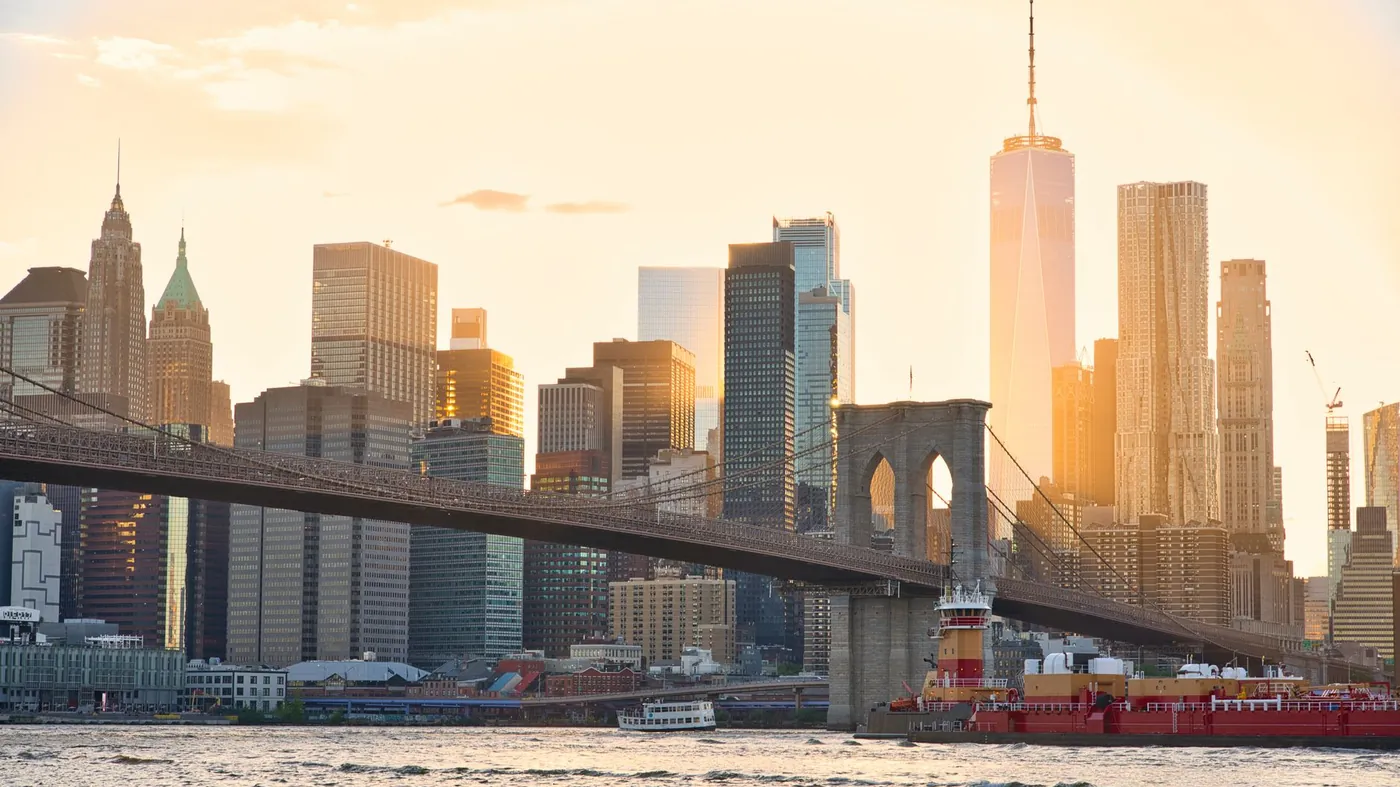 Brooklyn Bridge and the New York City skyline at sunset