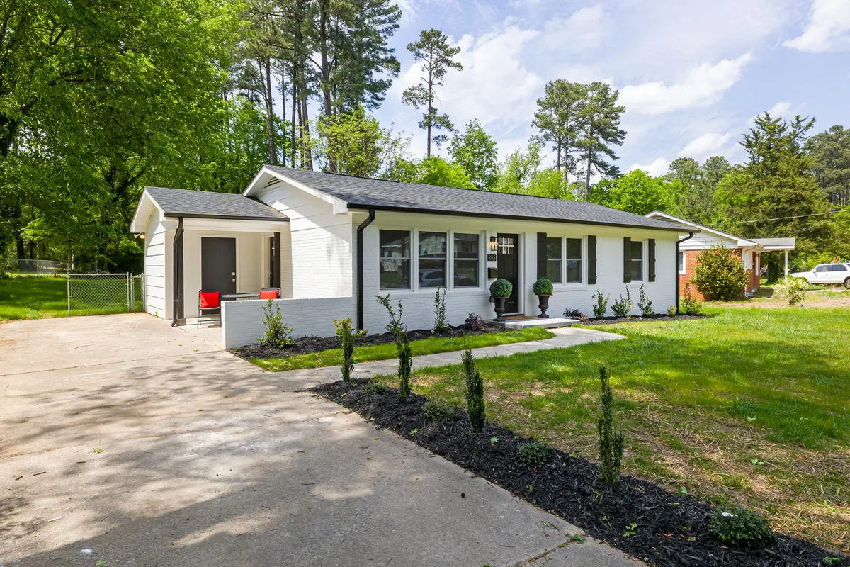 Modern suburban home with spacious yard and landscaping.