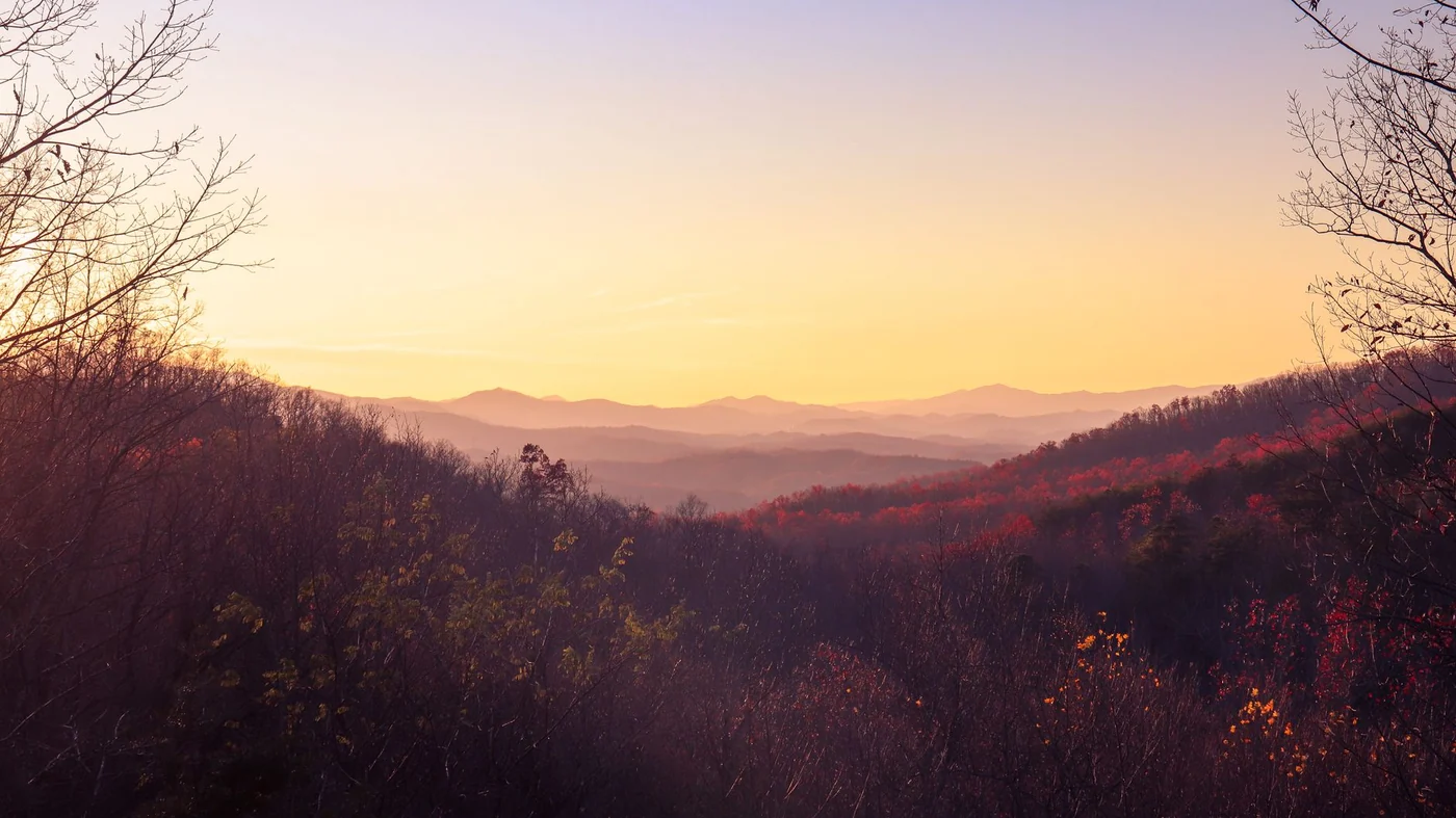 Sunrise over ridge after ridge of the Great Smoky Mountains in autumn colour