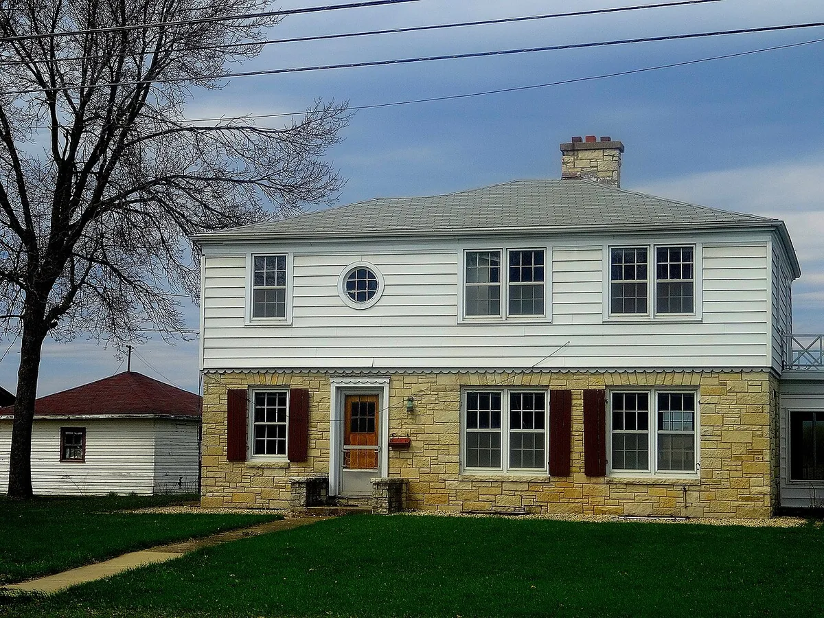 A white two-story house in Wisconsin